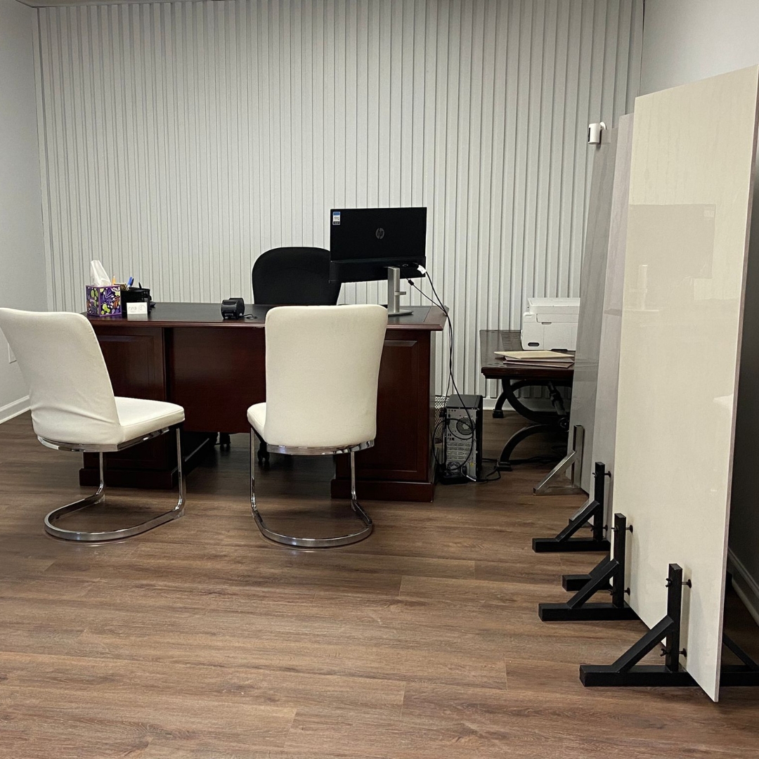 Luxury vinyl plank flooring and porcelain slabs in the JVB Decor showroom in Orlando